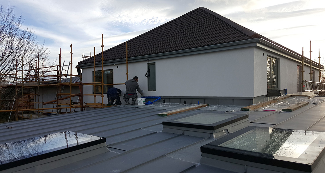 The house was wrapped with a Baumit external wall insulation system, with VM Zinc roofing and Fakro DXF triple glazed roof windows